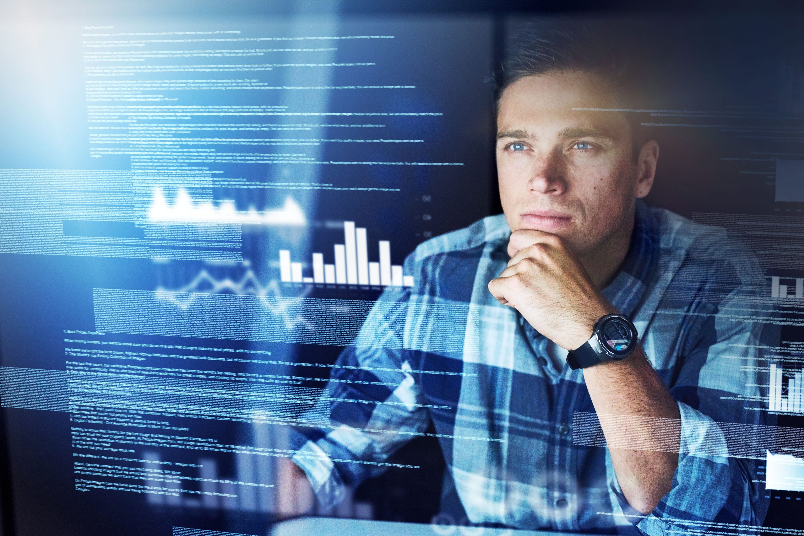 man looking at digital graphs